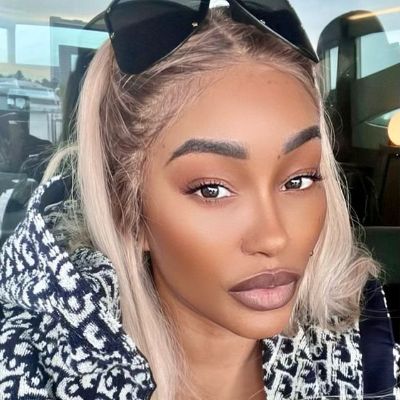 She has kept her shades above her head while taking a selfie. 